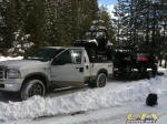 Polaris RZR S on the truck rack and two more on the trailer