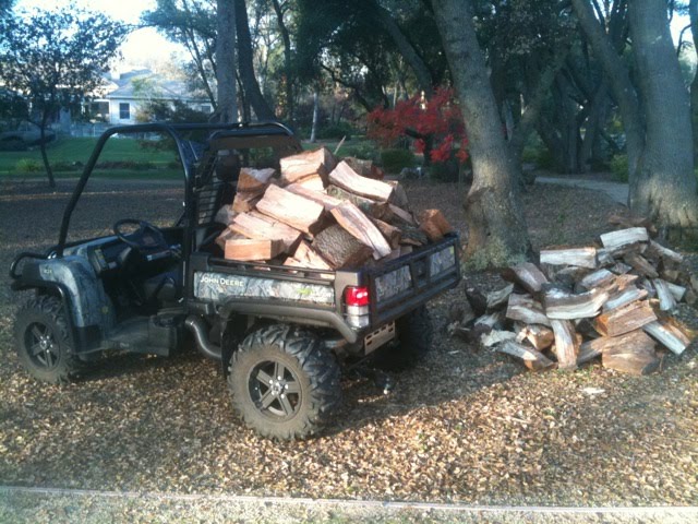 Hauling oak firewood with a John Deere Gator XUV 825i 