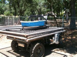 John Deere Gator XUV 825i hauling fence material