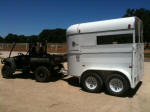 John Deere Gator XUV 825i towing trailer