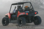 Polaris RZR with two seat roll cage