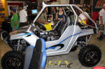 Long Travel Polaris RZR with aftermarket Roll Cage