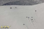 ATVs racing up Sand Mountain
